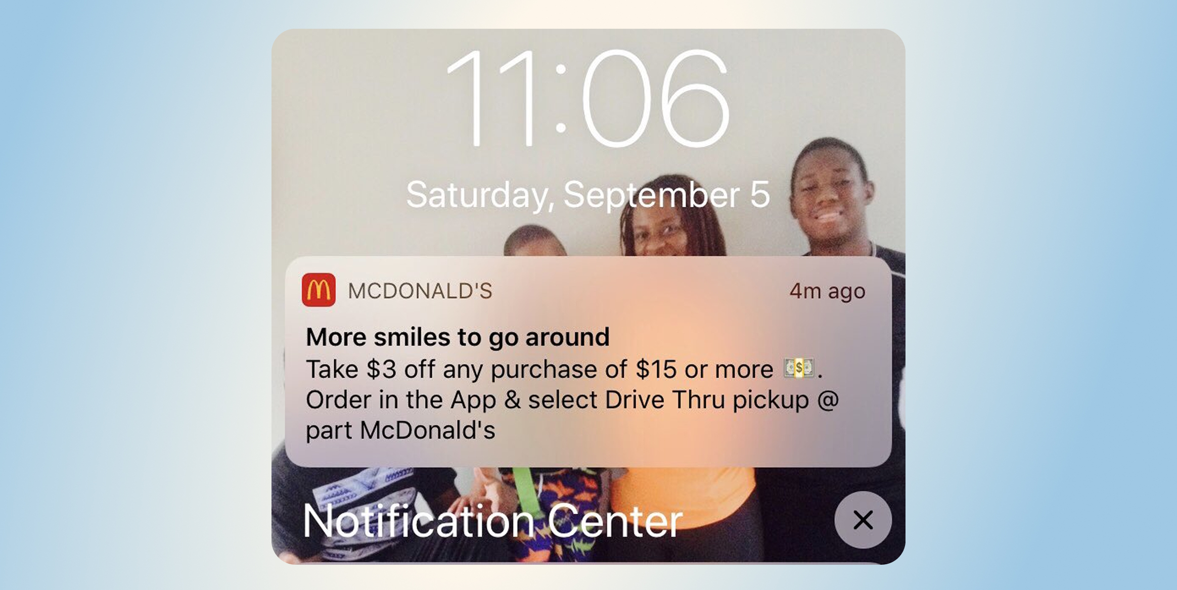 McDonald&rsquo;s: App-Only Perks and Loyalty-Driven Exclusivity. Lock screen showing a McDonald&rsquo;s promo notification: 'More smiles to go around' &mdash; take $3 off $15+ with drive-thru pickup offers (4m ago).